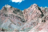 What type of feature is present in the notch in the center of the photograph?  