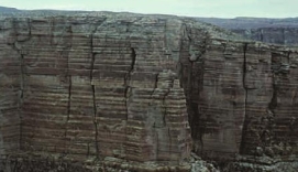 <strong>Where are the oldest rocks in the column of sedimentary rocks shown in the diagram? </strong> A) At the bottom B) At the top C) In the middle