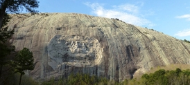 <strong>The image shows Stone Mountain in Georgia, a feature made of granite that was uncovered by erosion that removed the overlying and flanking softer rocks. What is the best name for this feature? </strong> A) An erosional remnant B) A mesa C) A thrust fault D) An anticline