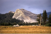 <strong>The feature in this photograph is an):  </strong> A) drumlin. B) roche moutonnée. C) esker. D) kame. <div style=padding-top: 35px> 