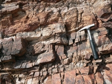 <strong>The layer of quartzite in this photograph would mostly weather by: </strong> A) dissolution B) hydrolysis C) physical weathering D) spontaneous combustion