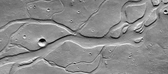<strong>What do these channels indicate about past events on Mars?  </strong> A) there were explosive volcanic eruptions B) strong winds eroded into a series of volcanic layers C) the surface once had running water that eroded and deposited sediment D) glaciers once covered the entire planet <div style=padding-top: 35px> 