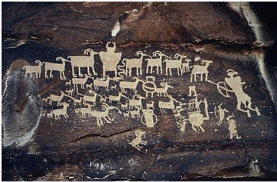 <strong>What does this ancient petroglyph tell us about the people who made it? </strong> A) The people who crafted this were part of a farming society. B) The people who crafted this were part of a hunting society. C) Only women were hunters in this society. D) This society honored its dead with large murals.