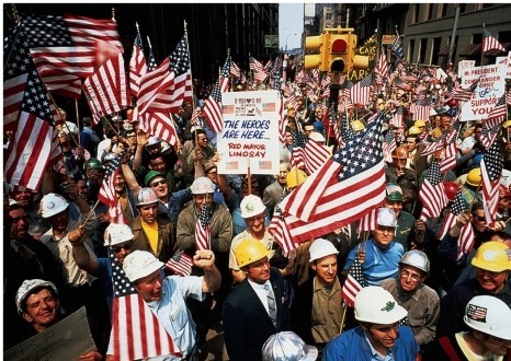 <strong>What can be inferred about the hard hats shown demonstrating in this image? </strong> A) They were antiwar student protestors. B) They were pro-war student protestors. C) They were pro-war union members. D) They were antiwar union members.
