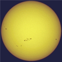 <strong>The figure shows the Sun and pairs of sunspots. One could say that there is really a 22-year sunspot cycle because  </strong> A)the time between sunspot number maxima is 22 years. B)the time between maxima of the same magnetic polarity of sunspot pairs is 22 years. C)it takes sunspots 22 years to move from the poles to the equator. D)at maximum there are 22 sunspots per year. <div style=padding-top: 35px> 