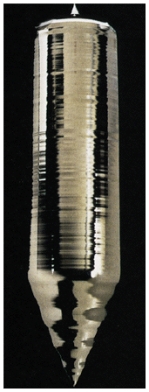 Silicon is one of the Group IV semiconductors and has an energy gap of 1.12 eV.Generally only metals have highly shiny surface,yet as shown in the figure,silicon appears to reflect like a metal.This is because