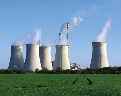 <strong>  The large structures in this photograph are</strong> A)smokestacks from a coal-fired power plant. B)special wind turbines that capture swirling wind to produce electricity. C)towers used to cool water heated by a coal-fired power plant. D)combustion chambers used to burn natural gas to generate electricity. <div style=padding-top: 35px> 