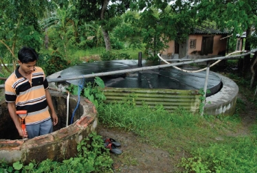 <strong> The two large tanks in this photo</strong> A)use manure,water,and anaerobic bacteria to produce biogas. B)use manure,water,and aerobic bacteria to produce biogas. C)burn unused parts of crop plants to generate heat for homes. D)collect and stores carbon dioxide in underground wells.