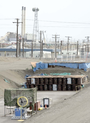 <strong> The hazardous-waste disposal system illustrated in this figure represents</strong> A)a secure landfill. B)a deep-well injection. C)an on-site surface impoundment. D)a best-demonstrated available technology.