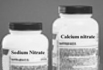 <strong>The following two containers are found on a stock room counter. How many atoms of nitrogen are in a formula unit of each from left to right,respectively?</strong> A)1 nitrogen atom,1 nitrogen atom B)1 nitrogen atom,2 nitrogen atoms C)2 nitrogen atoms,1 nitrogen atoms D)2 nitrogen atoms,2 nitrogen atoms E)3 nitrogen atoms,6 nitrogen atoms
