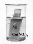 Consider the following beakers.In the beaker on the left copper metal is placed in a solution of silver nitrate.The reaction is allowed to run for 60 minutes producing the products shown on the right.     The equation for the oxidation half-reaction would be: