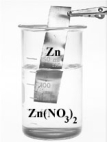 Examine the two beakers shown below.     If the metals were connected by a wire containing a meter and the two solutions by a salt bridge,the meter shows are reading of 0.95 V.Which of the following is correct?