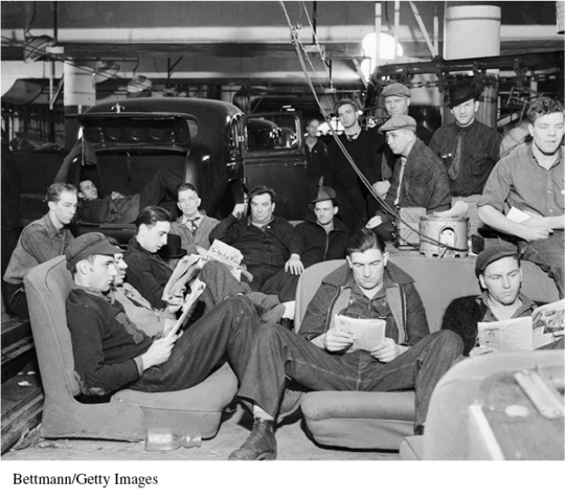 <strong>For the following question,refer to the following photograph of a United Auto Workers strike in Flint,Michigan,on January 9,1937. The activities depicted in the photograph above best serve as evidence of</strong> A) the New Deal's inability to overcome the Depression. B) the migrations of Americans during the Great Depression. C) political and social organizations struggling to address the effects of industrialization and economic uncertainty. D) the use of government power to provide relief to the poor and reform the American economy.
