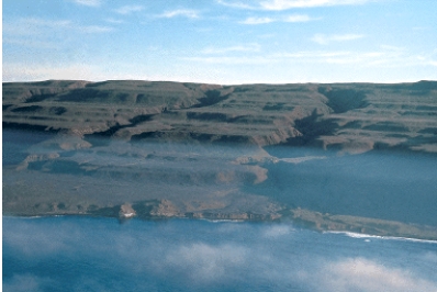 <strong>A marine terrace, like those shown below, could be formed from : </strong> A)littoral drift B)deposition C)tectonic uplift D)a tsunami