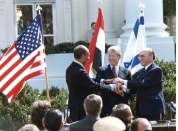 <strong> Credit: Carter Archives/ZUMA Press,Inc./Alamy Stock Photo -Which presidential power did Carter employ in negotiating the Camp David Accords?</strong> A)chief diplomat B)commander in chief -Consider This: Commander in chief refers more to the president's leadership in wartime than brokering peace between two other nations. C)war powers D)diplomatic envoys