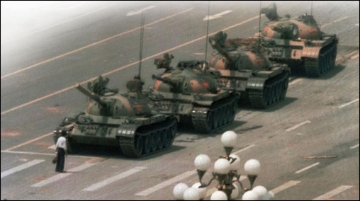 <strong> How do these images of the man with the hammer in Berlin and Tank Man in Beijing's Tiananmen Square tell two different stories about Communism in Eastern Europe and China in the late 1980s?</strong> A) Eastern European nations suffered severe retaliations for demonstrating against Communism, while Chinese officials responded with economic and political reforms. B) Soviet troops invaded protesting Eastern European nations, while the Chinese were more responsive to human rights. C) The man with the hammer was arrested and probably executed for his actions, while Tank Man became known for his defense of human rights. D) Communism in most of Eastern Europe fell through peaceful demonstrations, while demonstrators in China were unsuccessful in their attempts to bring about reform.