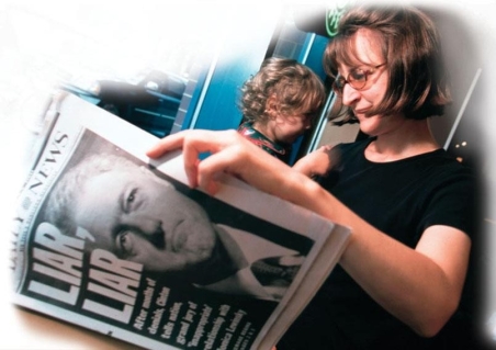 <strong> Based on the newspaper in the photograph, it can be concluded that Bill Clinton was impeached by the House of Representatives for .</strong> A) denying he had an affair while testifying under oath on an unrelated matter B) having an affair with White House intern Monica Lewinsky C) deceiving the American public on television about his relationship with Lewinsky D) having sexual relationships with multiple women after he was married