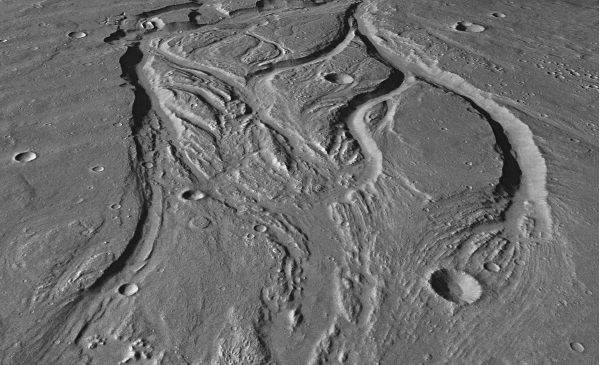 <strong>Below is an oblique view showing landforms on Mars.What process is most likely responsible for creating this landscape? </strong> A) glacial carving B) deposition C) flowing water D) burrowing