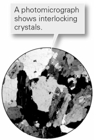 <strong>What type of texture is shown in this photomicrograph? </strong> A) foliation B) crystalline C) sedimentary D) clastic