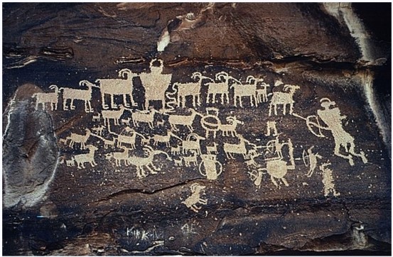 <strong>What does this ancient petroglyph tell us about the people who made it?  </strong> A) The people who crafted this were part of a farming society. B) The people who crafted this were part of a hunting society. C) Only women were hunters in this society. D) This society honored its dead with large murals. <div style=padding-top: 35px> 