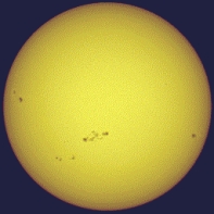 <strong>The figure shows the sun and pairs of sunspots.One could say that there is really a 22 year sunspot cycle because ...  </strong> A) the time between sunspot number maxima is 22 years. B) the time between maxima of the same magnetic polarity of sunspot pairs is 22 years. C) it takes sunspots 22 years to move from the poles to the equator. D) at maximum there are 22 sunspots per year. <div style=padding-top: 35px> 