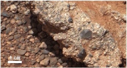 <strong> What kind of environment would have produced the Martian rock visible here?</strong> A)Stream B)Desert C)Beach D)Evaporating lake