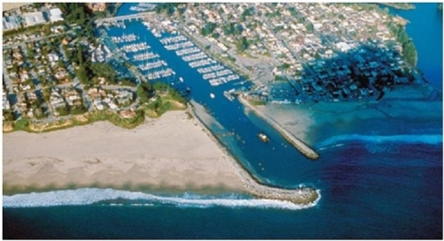 <strong> What coastal erosion stabilizers are visible in this image?</strong> A)Headlands B)Jetties C)Breakwaters D)Groins