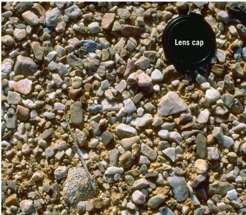 <strong> What desert feature is visible in this image?</strong> A)Playa lake B)Sand dune C)Desert pavement D)Yardang