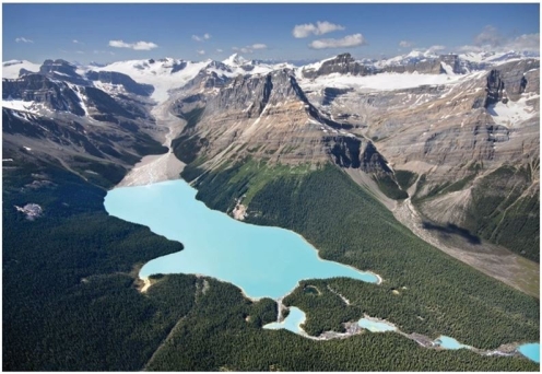 <strong> What substance is responsible for the turquoise color of the water in this image?</strong> A)Till B)Outwash C)Oxidation D)Rock flour