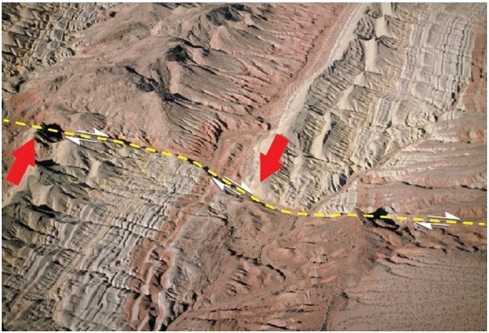 <strong> What kind of fault is present in this image?</strong> A)Normal fault B)Reverse fault C)Left-lateral strike-slip fault D)Right-lateral strike-slip fault