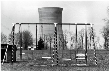 <strong>The photo Three Mile Island Nuclear Plan, 1979 shows part of the nuclear power plant outside Harrisburg, Pennsylvania, behind an empty swing-set. What conclusions can you draw from this image?  </strong> A) Local residents and governments had previously felt safe around nuclear power. B) City planners had not considered how unattractive a nuclear reactor would be. C) The neighborhood around the nuclear reactor had already been suffering from blight. D) The neighborhood around the nuclear reactor had been predominantly black. <div style=padding-top: 35px> 