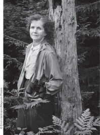 Identify the two people in the photograph below and describe their contributions to our understanding of the environment and the environmental movement in the United States.