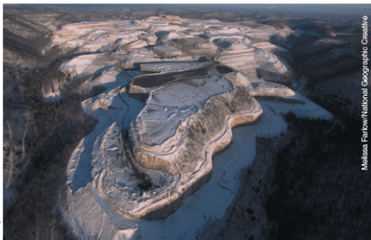What type of mining operation is illustrated below? What are the advantages and disadvantages of this type of mining? How does it compare to other methods of extraction minerals and energy resources?