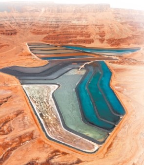 The two photos below show two different ways that mining contaminates the environment. Compare and contrast the specific ways that mining affects the environment in each case. A B