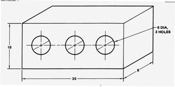 If all dimensions are in inches, what is the volume of this holding block, in cubic inches?