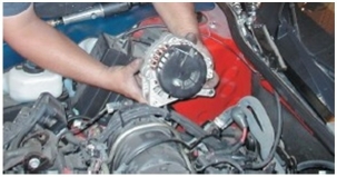 What component is the technician holding?  