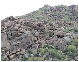 <strong>116)What type of rock likely composes the landscape shown in this photograph from the Investigation? </strong> A)granite B)sedimentary rocks C)volcanic rocks, probably basalt D)metamorphic rocks
