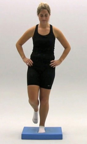<strong>What is being performed for a head assessment in the following figures? </strong> A) Balance Error Scoring System (BESS) B) Romberg test C) Cranial nerve testing D) Motor testing E) Strength testing