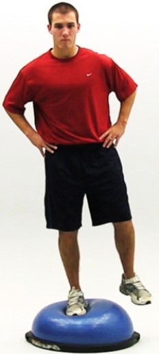 <strong>Which major component of a rehabilitation program is shown in the photo? </strong> A) Reestablishing neuromuscular control B) Establishing/enhancing core stability C) Restoring muscular strength, endurance, and power D) Restoring range of motion E) Regaining postural stability and balance F) Maintaining cardiorespiratory fitness G) Incorporating functional progression