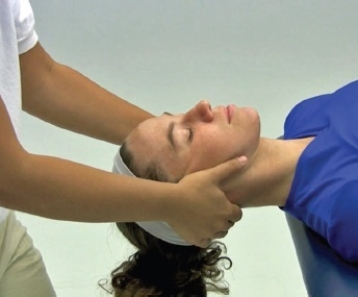 <strong>What is being performed in the following illustration? </strong> A) Manual cervical traction B) Mechanical scapular traction C) Positional cervical traction D) Inverted cervical E) Manual cervical traction with joint mobilization