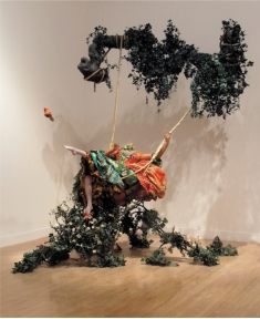 <strong> Yinka Shonibare MBE's The Swing (After Fragonard) (figure 21.3A) is Postmodern because it:</strong> A) Appropriates Dutch art and rejects globalization B) Incorporates gender themes and questions the importance of the artist C) Is an installation that includes sculpture D) Questions the originality of art and uses diverse media