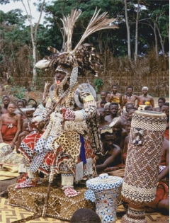 and contrast the Kuba King in state dress (Figure 1.31) with Jean-Auguste-Dominique Ingres's Napoleon Enthroned (Figure 1.34), in terms of attire, items they hold in their hands, where they are seated, size of the men, date photographed/depicted, and location where the men ruled. What do the two images say about the how the social order is promoted in art created by people from different backgrounds and periods?