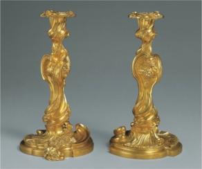 <strong> The asymmetrical, organic forms of Juste Aurèle Meissonnier's pair of candlesticks (figure 19.7) are typical of:</strong> A) Art Nouveau's interest in natural forms and art for everyday life B) The Rococo's interest in decoration and playfulness C) Romanticism's interest in drama and movement D) Neoclassicism's interest in looking backward and convention