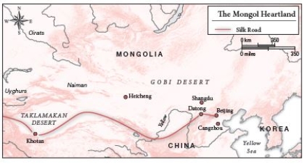 -Looking at Map 4.2, the Silk Road was ________ the traditional territory of the Mongols.