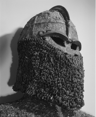 <strong> Which aspect of Viking tactics does this helmet best exemplify?</strong> A) Using physical appearance to frighten the enemy B) Rejecting metal in traditional armor C) Learning crafts and artistic skills D) Withdrawing quickly after an attack