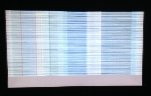 <strong>This is a picture of a monitor that has a horizontally torn image. What is the most common cause of a monitor showing horizontally torn images on the screen?  </strong> A) Video cable not properly seated. B) Refresh rate out of specification. C) Not enough video memory. D) GPU on video card overheating. <div style=padding-top: 35px> 