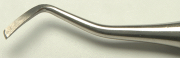 <strong>Identify the following cutting instrument: </strong> A) Mesial marginal trimmer B) Binangle chisel C) Distal marginal trimmer D) Enamel hatchet