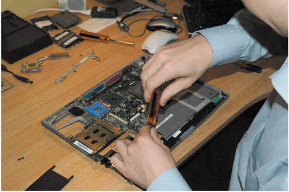 As shown in the accompanying figure, a(n) ____________________ installs, maintains, repairs, and troubleshoots hardware and installs, upgrades, and configures software.