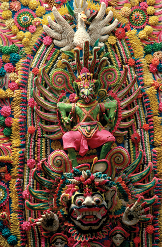 <strong> Which statement about Sarad offering is correct?</strong> A)Sarad offering was built to be the permanent focus of the temple space. B)Balinese priests created Sarad offering from rice dough. C)Balinese families created Sarad offering from rice dough. D)Sarad offering can be considered an equestrian statue.