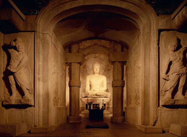 <strong> What is the location of the structure and statue depicted here?</strong> A) Yingxian B) Gyeongju C) Seokguram D) Xi'an